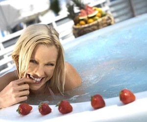 eating strawberries in a hot tub
